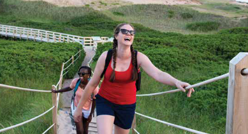 2024 Trail Guide cover image of two young adults hiking
